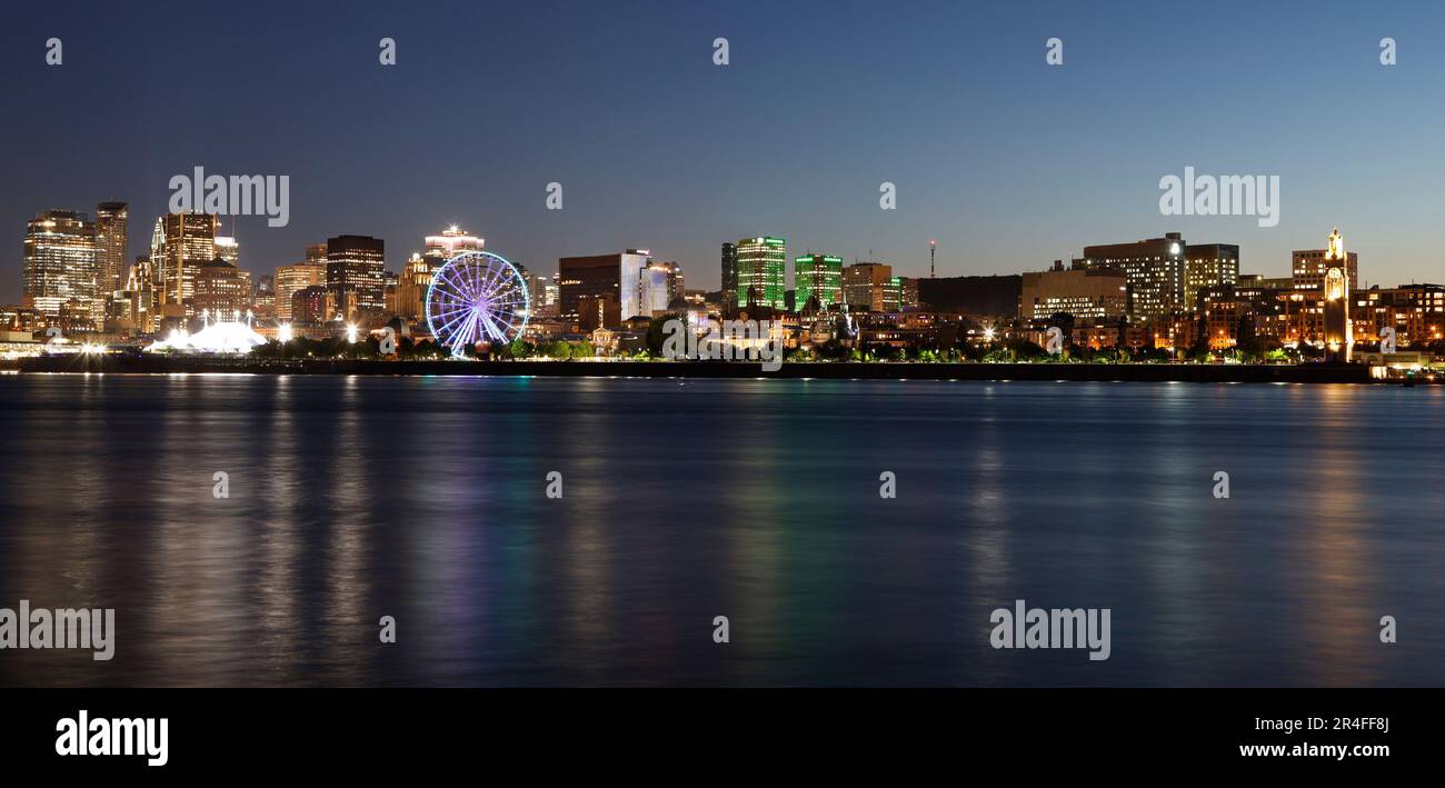 Montreal skyline and St Lawrence River at night, Quebec, Canada Stock Photo