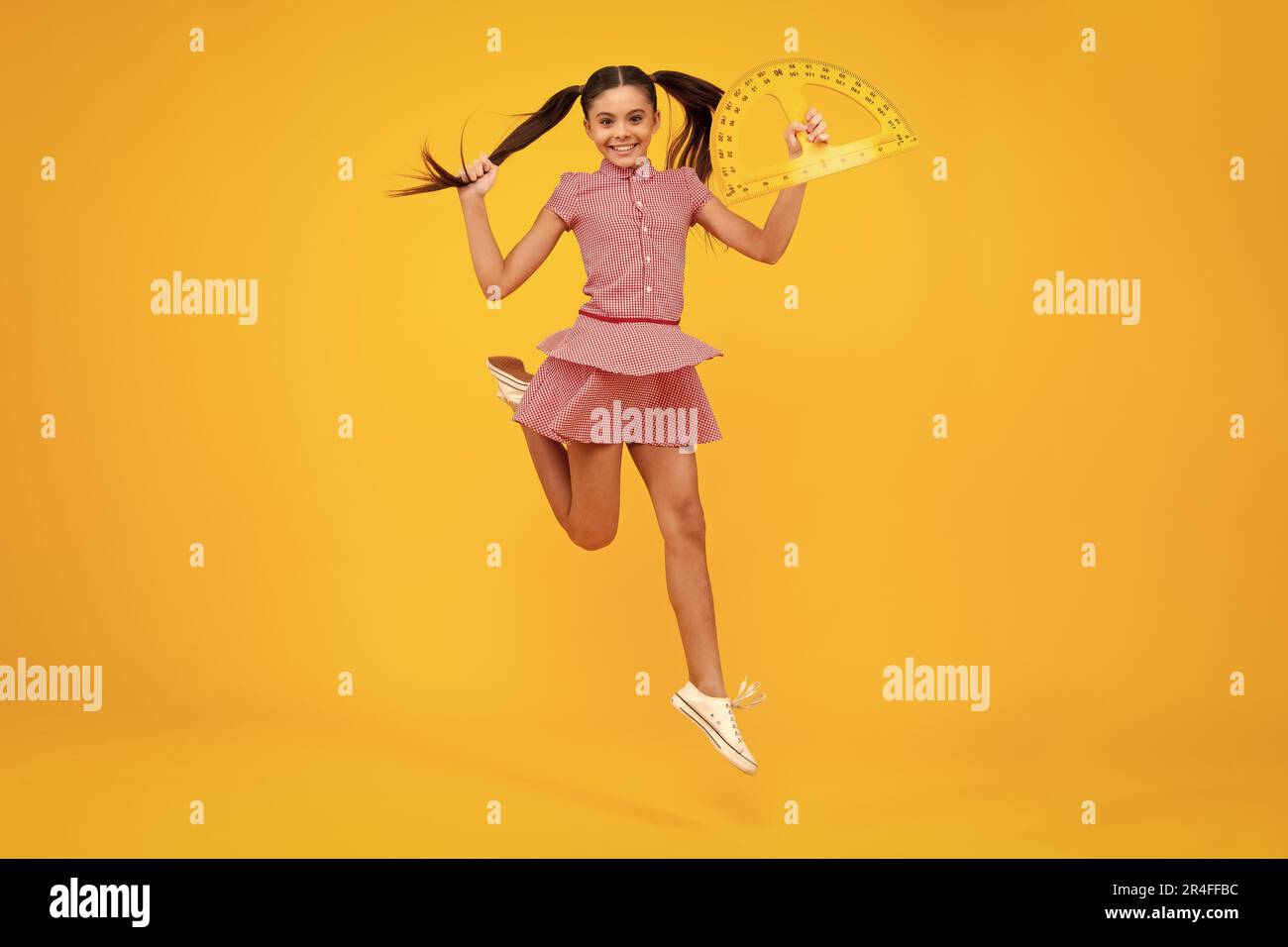 Teenager school girl study math or geometry lesson, measure the size ...