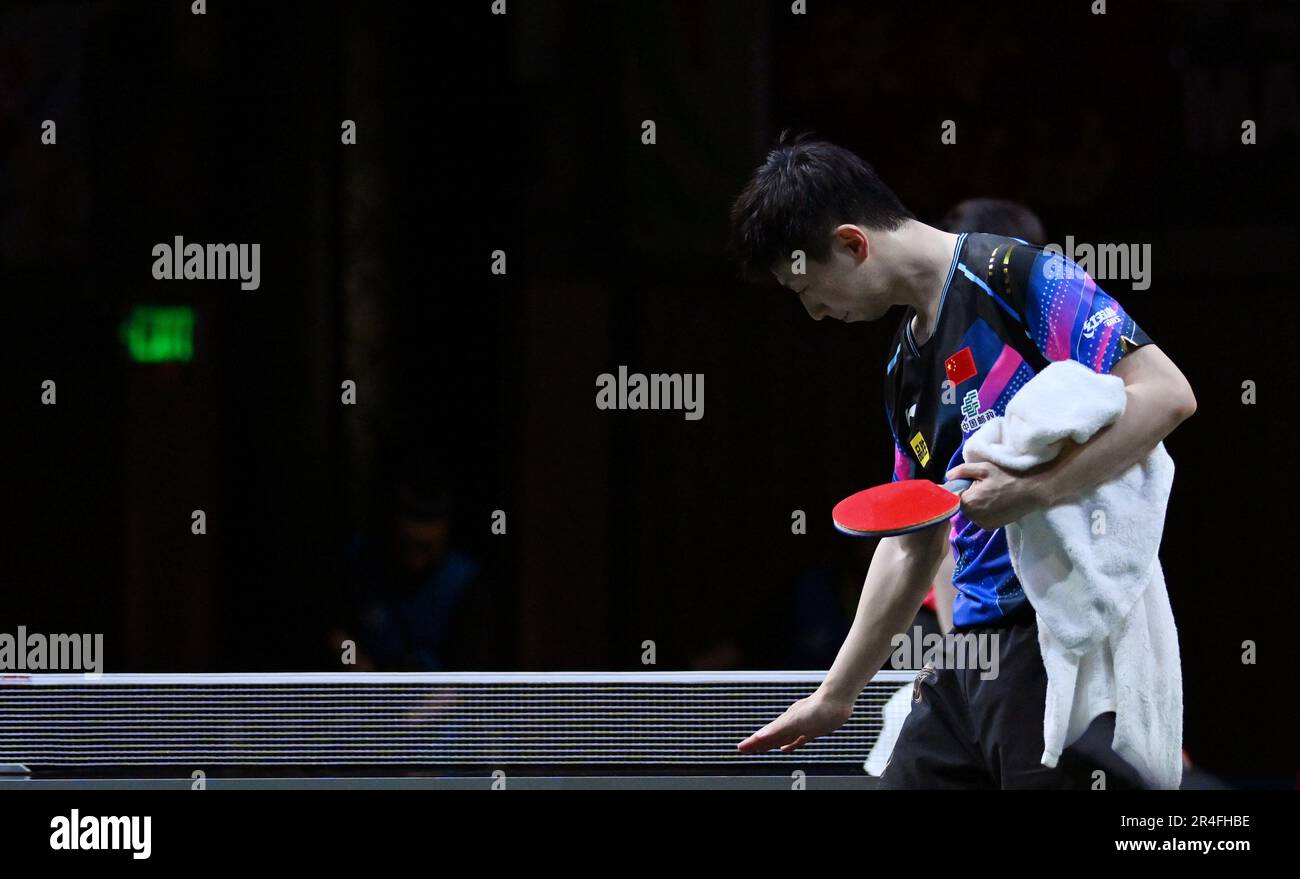 Durban, South Africa. 27th May, 2023. Ma Long touches table before leaving after the men's singles semifinal match between Ma Long of China and Wang Chuqin of China at 2023 ITTF Table Tennis World Championships Finals in Durban, South Africa, May 27, 2023. Credit: Tao Xiyi/Xinhua/Alamy Live News Stock Photo
