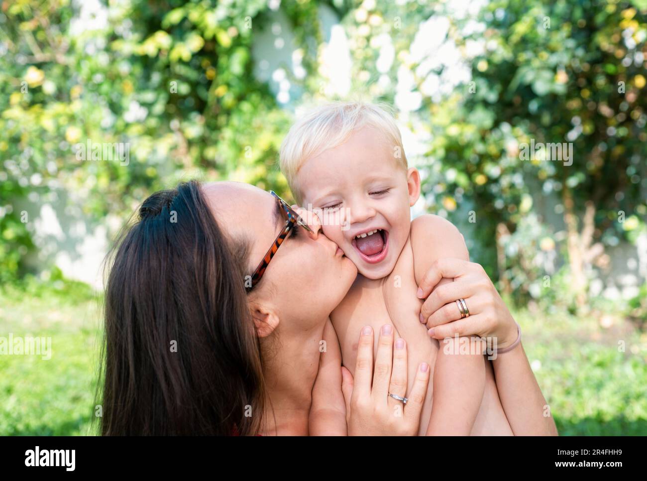 Happy child son hug mom. Family mother and boy smiling and hugging ...