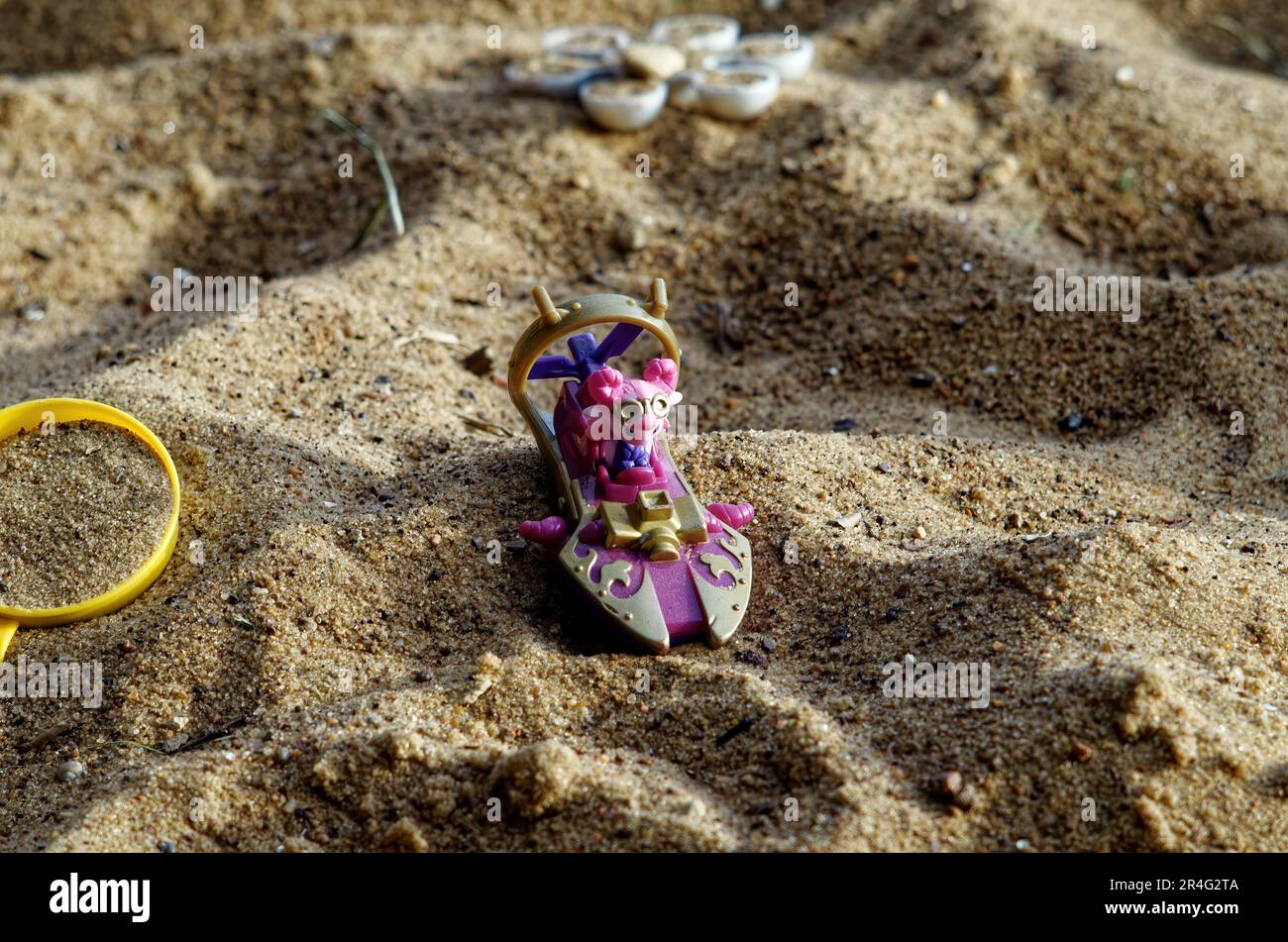 Old toys in the sandbox, russia Stock Photo