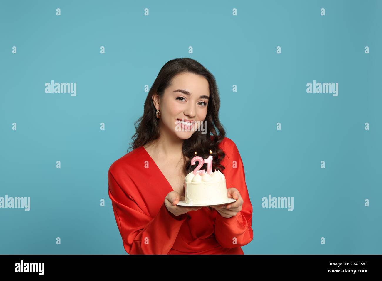 Coming of age party 21st birthday. Woman holding cake with number — free download