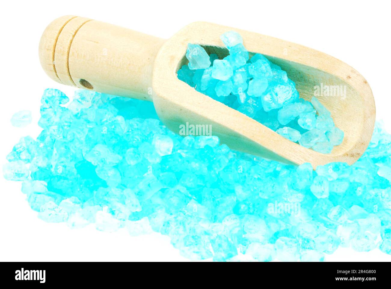 Isolated blue bath salt in a woode spoon Stock Photo