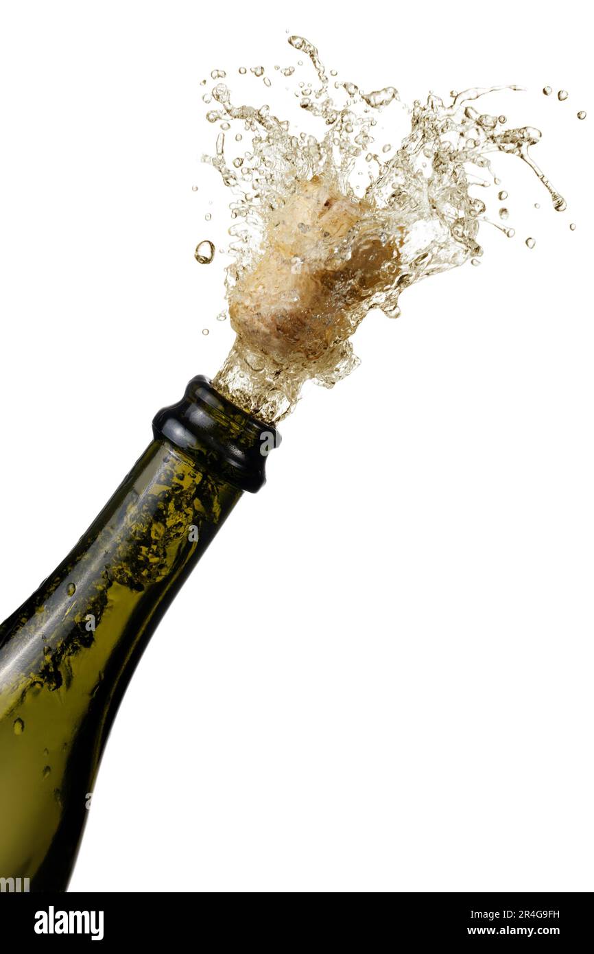 bottle of champagne popping its cork and splashing Stock Photo Alamy