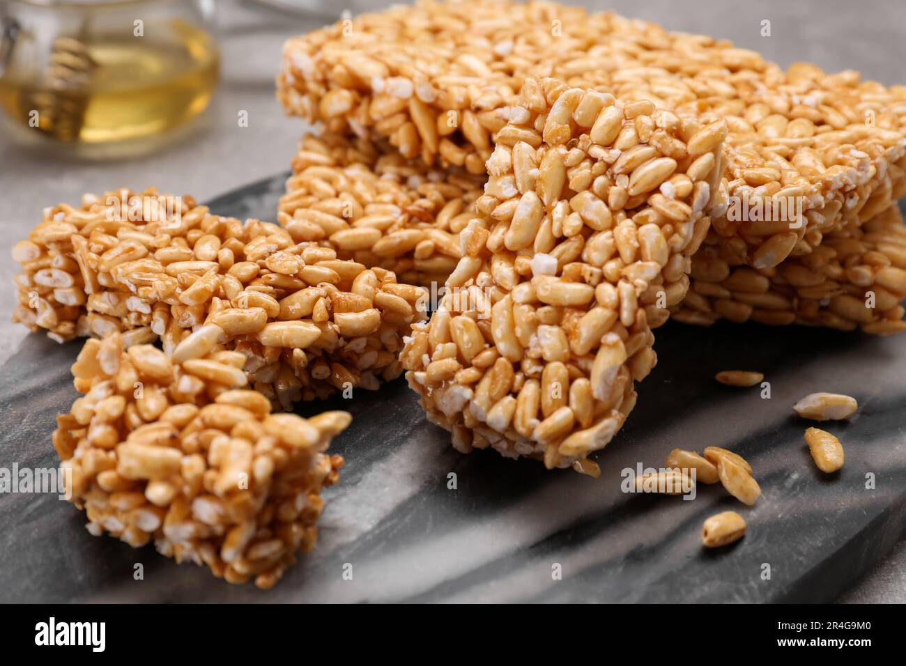 Puffed rice bars (kozinaki) on board, closeup Stock Photo