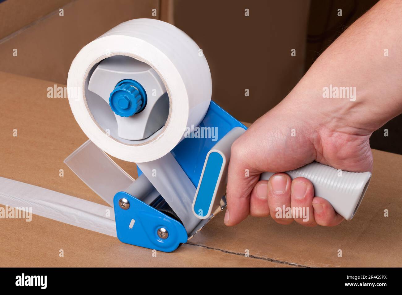 Cardboard boxes stick dispenser for adhesive tape Stock Photo Alamy