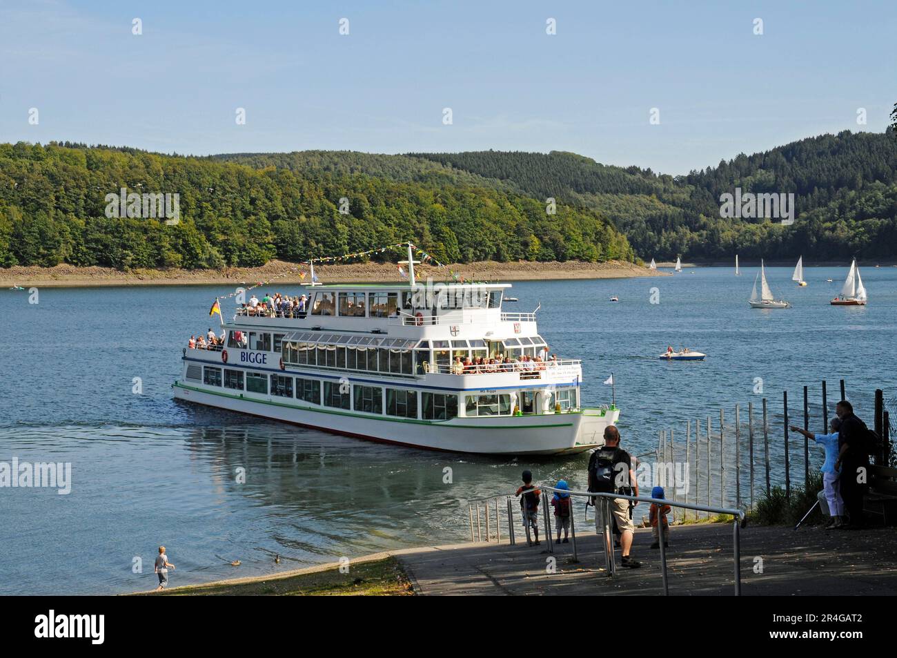 Excursion boat, lake, jetty, pier, passenger ship, Sondern, Biggetalsperre, Olpe, Ebbegebirge nature Park, Sauerland, North Rhine-Westphalia, Germany Stock Photo