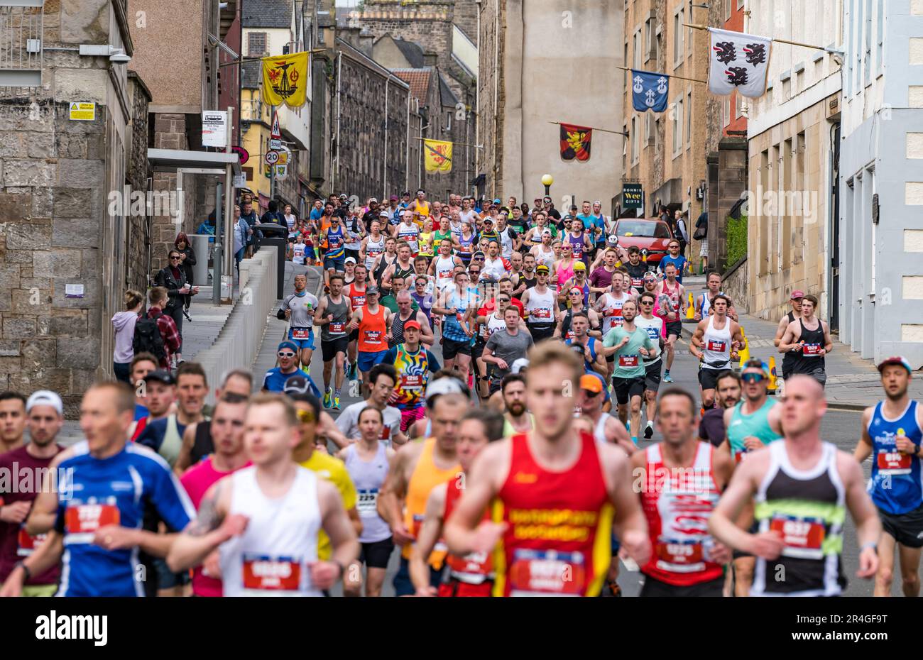 Edinburgh, Scotland, UK, 28th May 2023. Edinburgh Marathon: some of thousands of marathon runners run down the Royal Mile in the early stage of the route. Credit: Sally Anderson/Alamy Live News Stock Photo