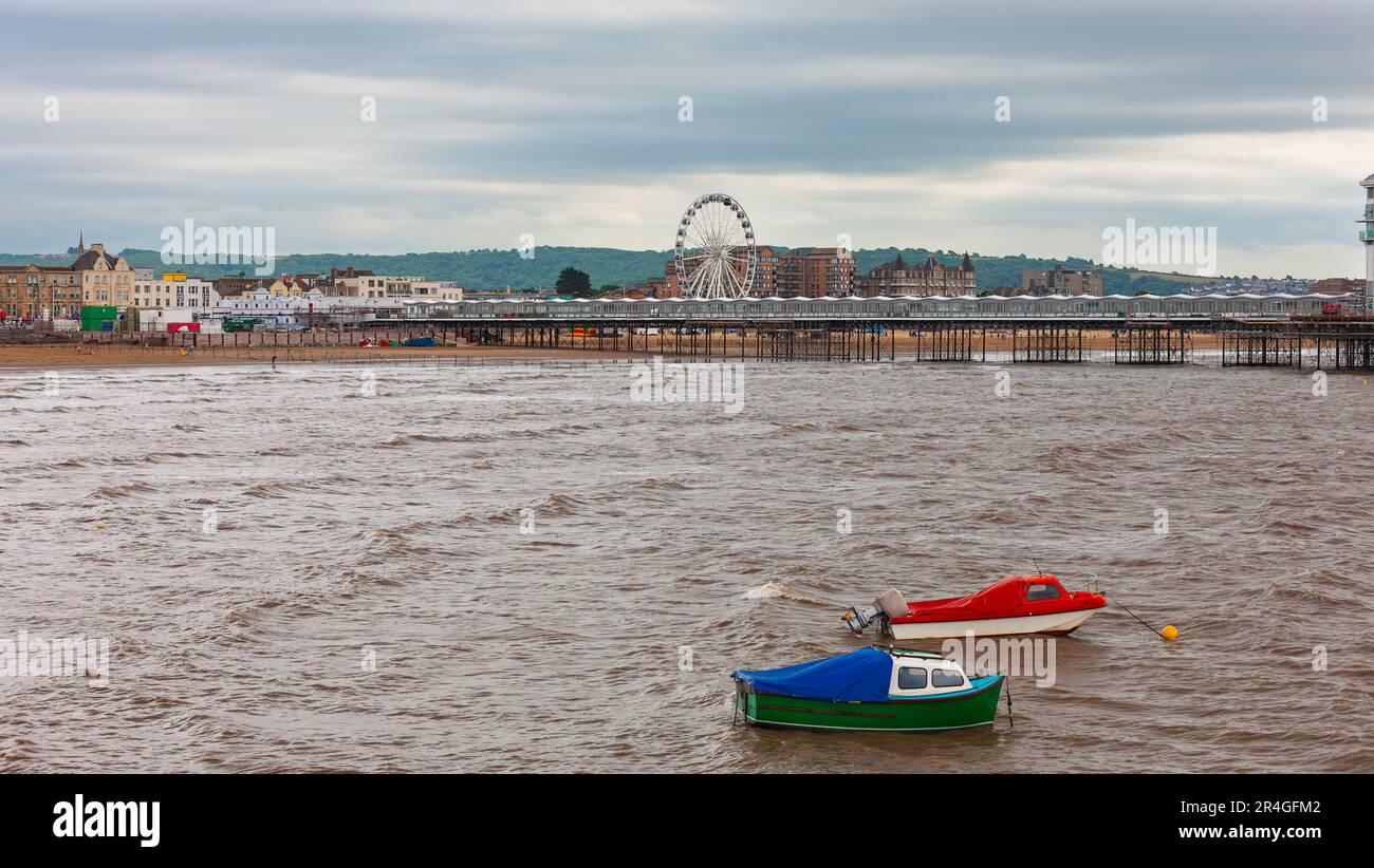 Weston-Super-Mare, United Kingdom - July 4, 2010 : Boats anchored out beyond shoreline at the popular western England town. Stock Photo