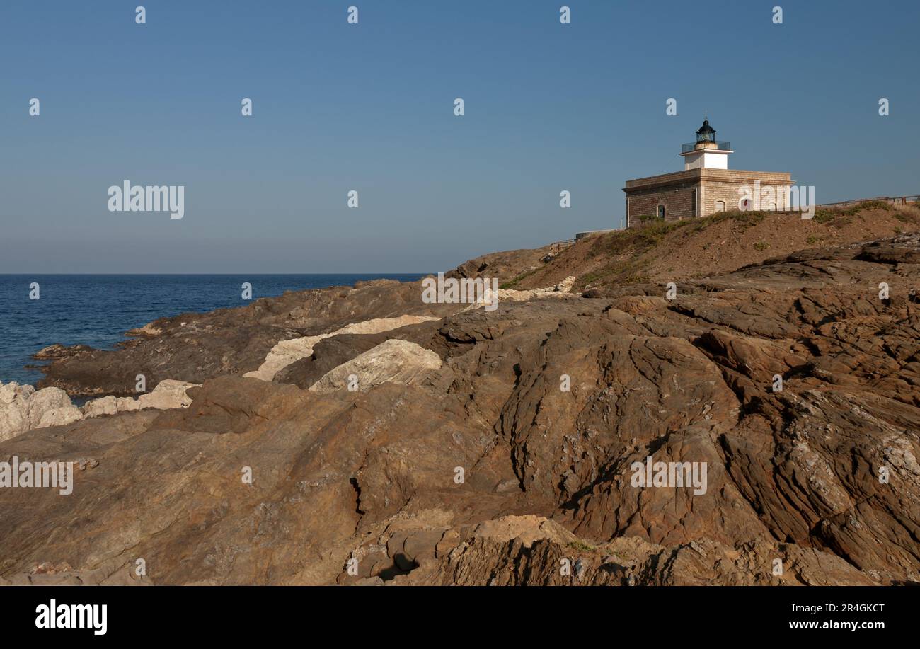 Typical Lighthouse Small lighthouse of s'Arenella, in Girona, on top of some steep rocks ...