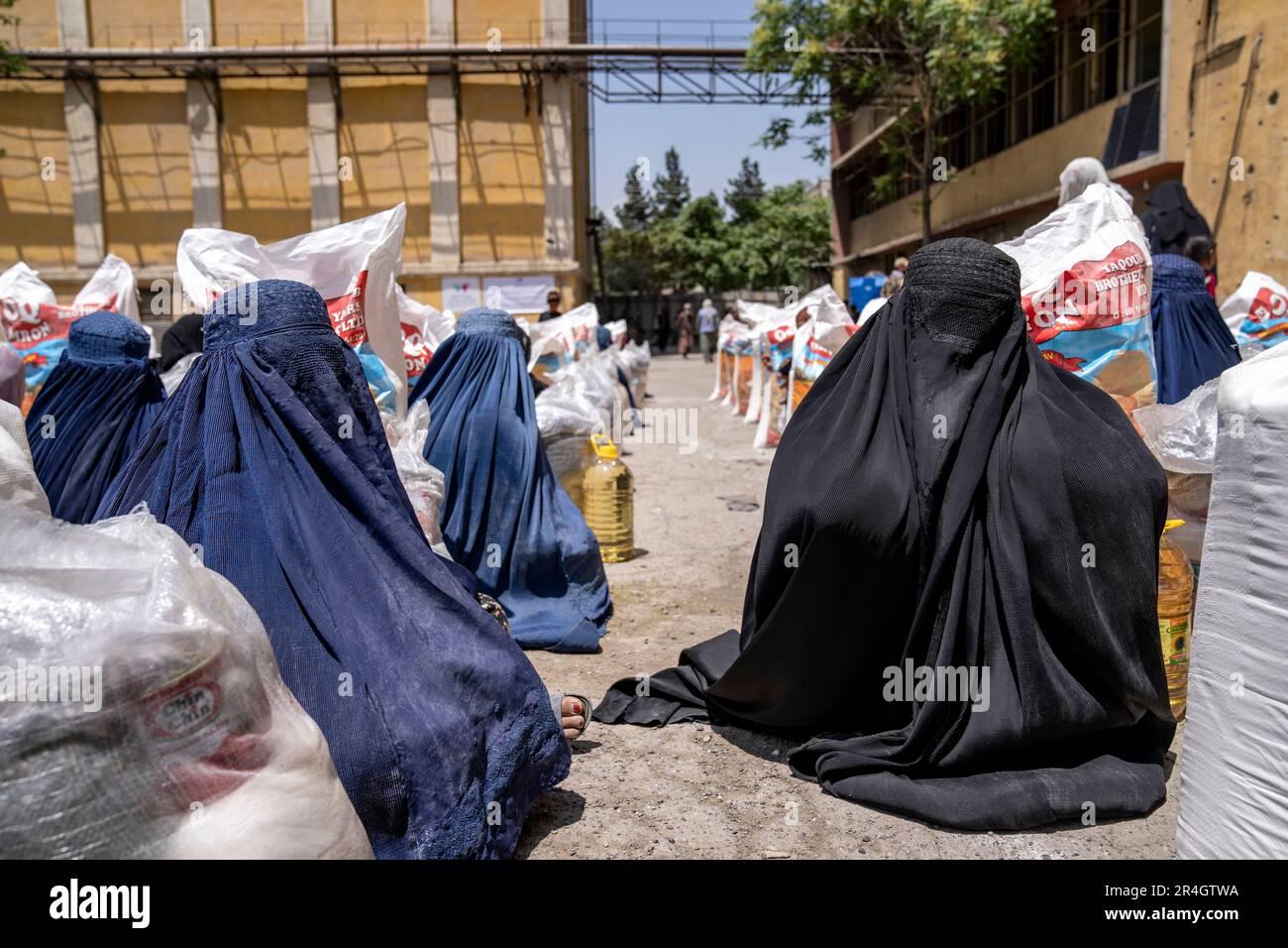 Humainitarian Aid Ration Afghan women receive food rations distributed by a humanitarian aid ...