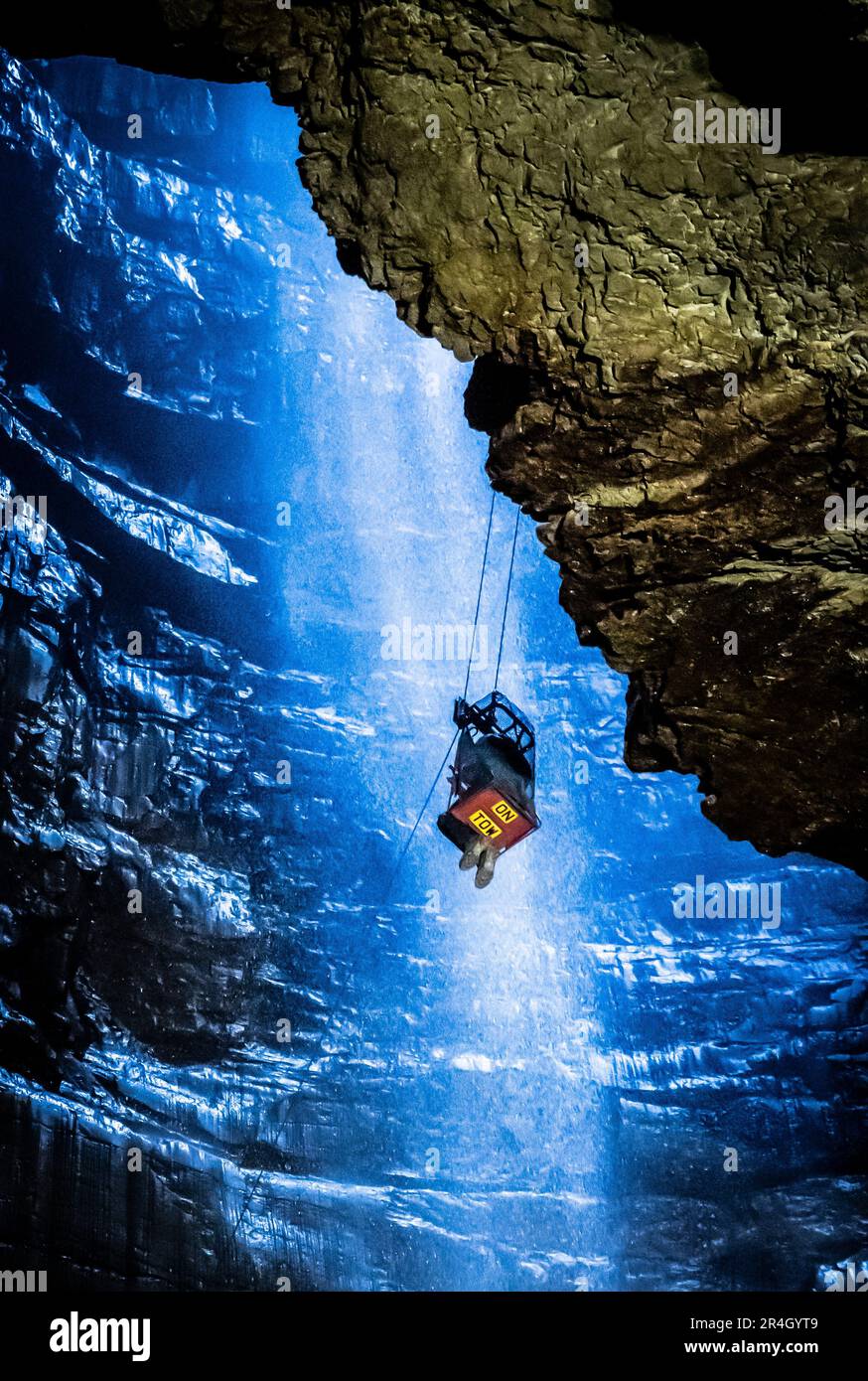A potholer is winched into Gaping Gill, the largest cavern in Britain