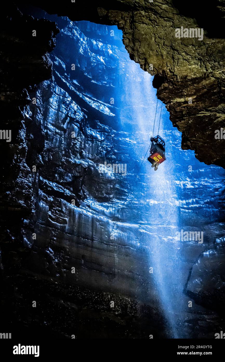 A potholer is winched into Gaping Gill, the largest cavern in Britain