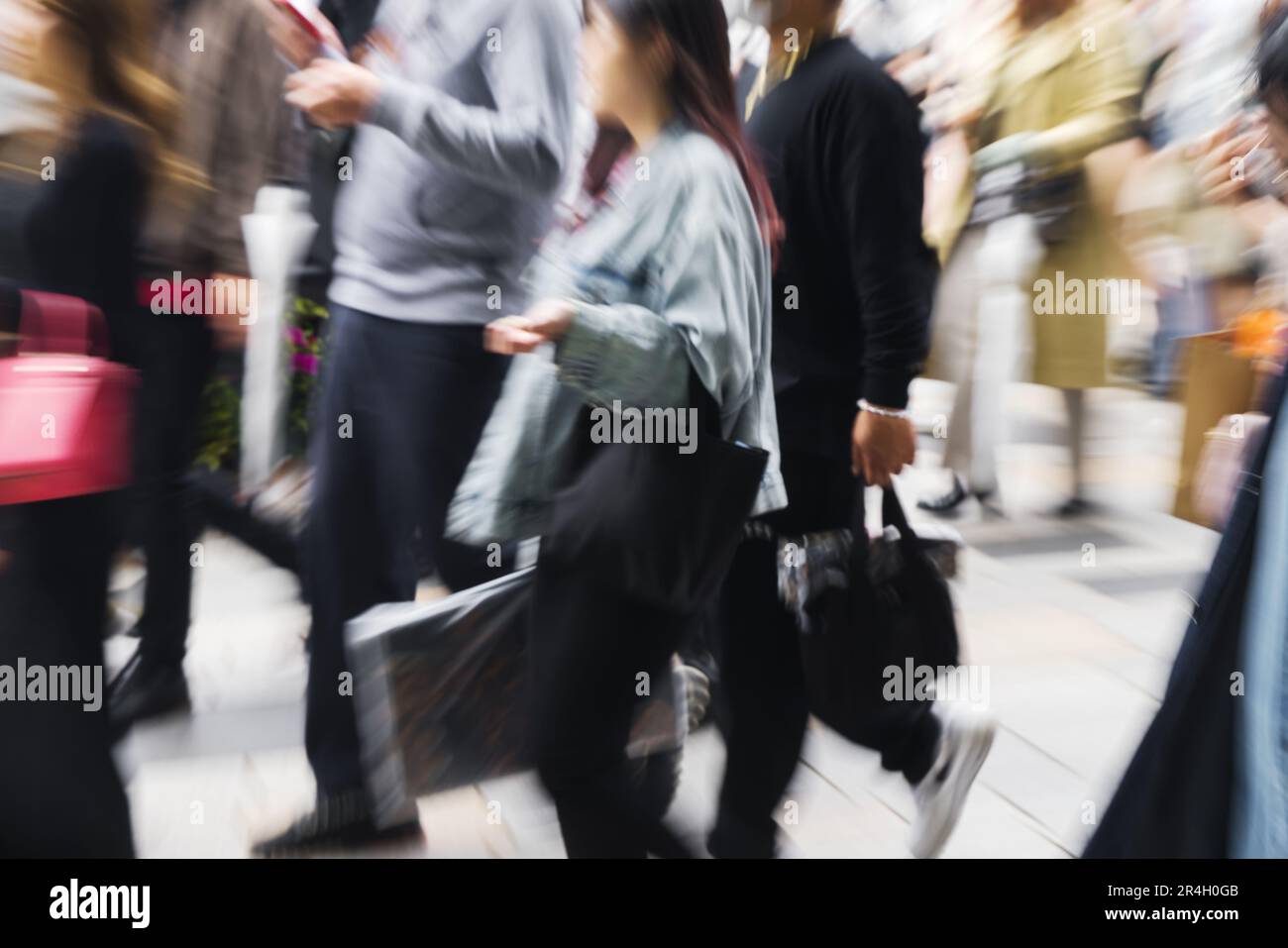 picture with camera made motion blur effect of a crowd of people ...