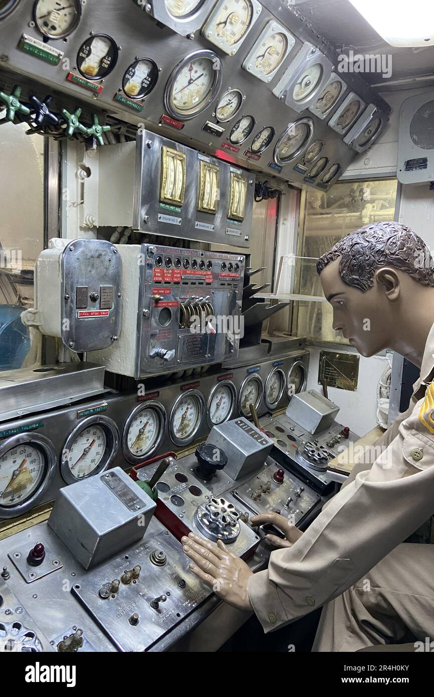Interior control panel of a retired vintage German military submarine naval sea vessel navy warship radio control room demonstrated soldier on duty Stock Photo