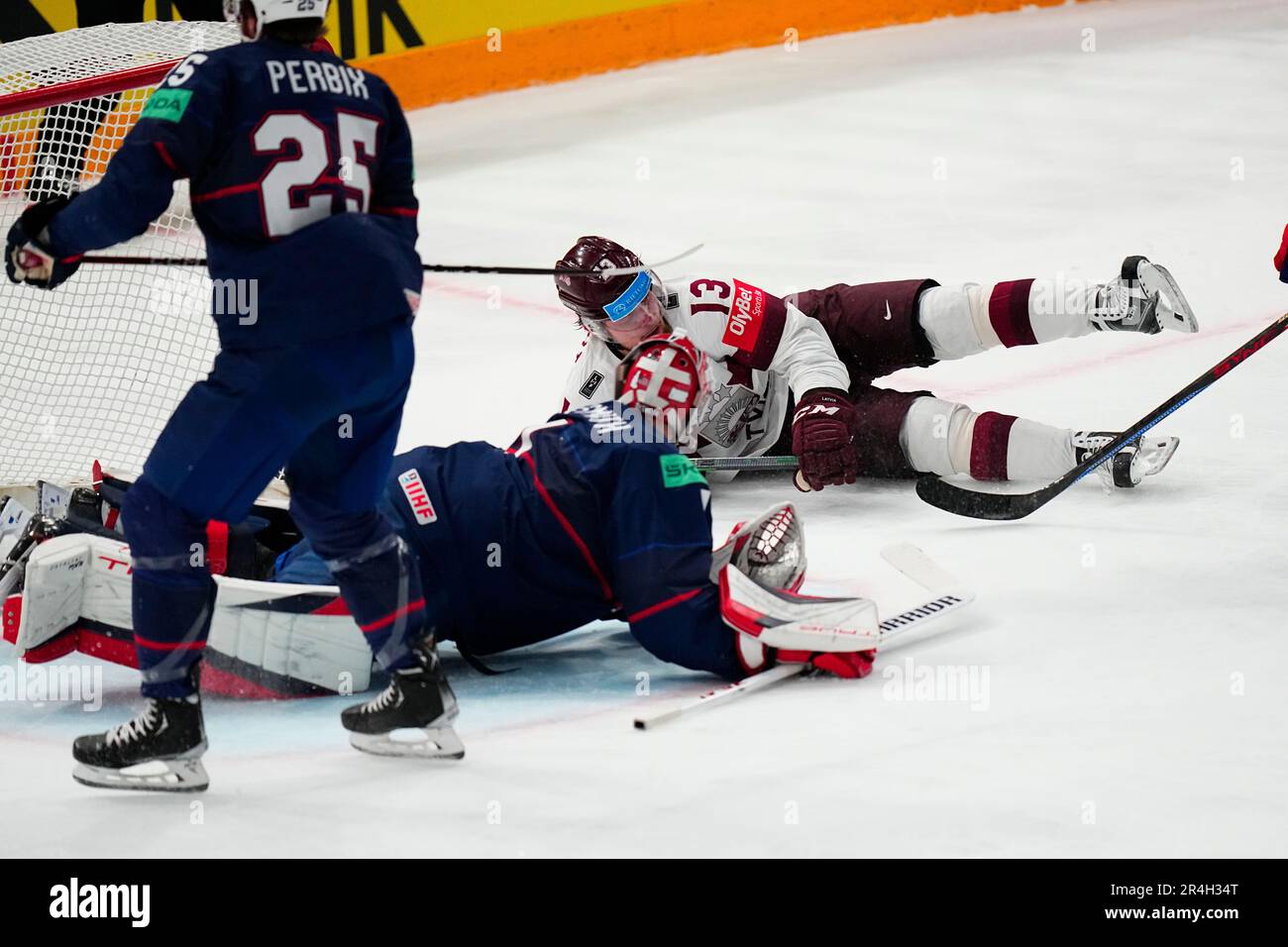 United States goalie Casey DeSmith defends the net against Latvias Rihards Bukarts (13) in their bronze medal match at the Ice Hockey World Championship in Tampere, Finland, Sunday, May 28, 2023