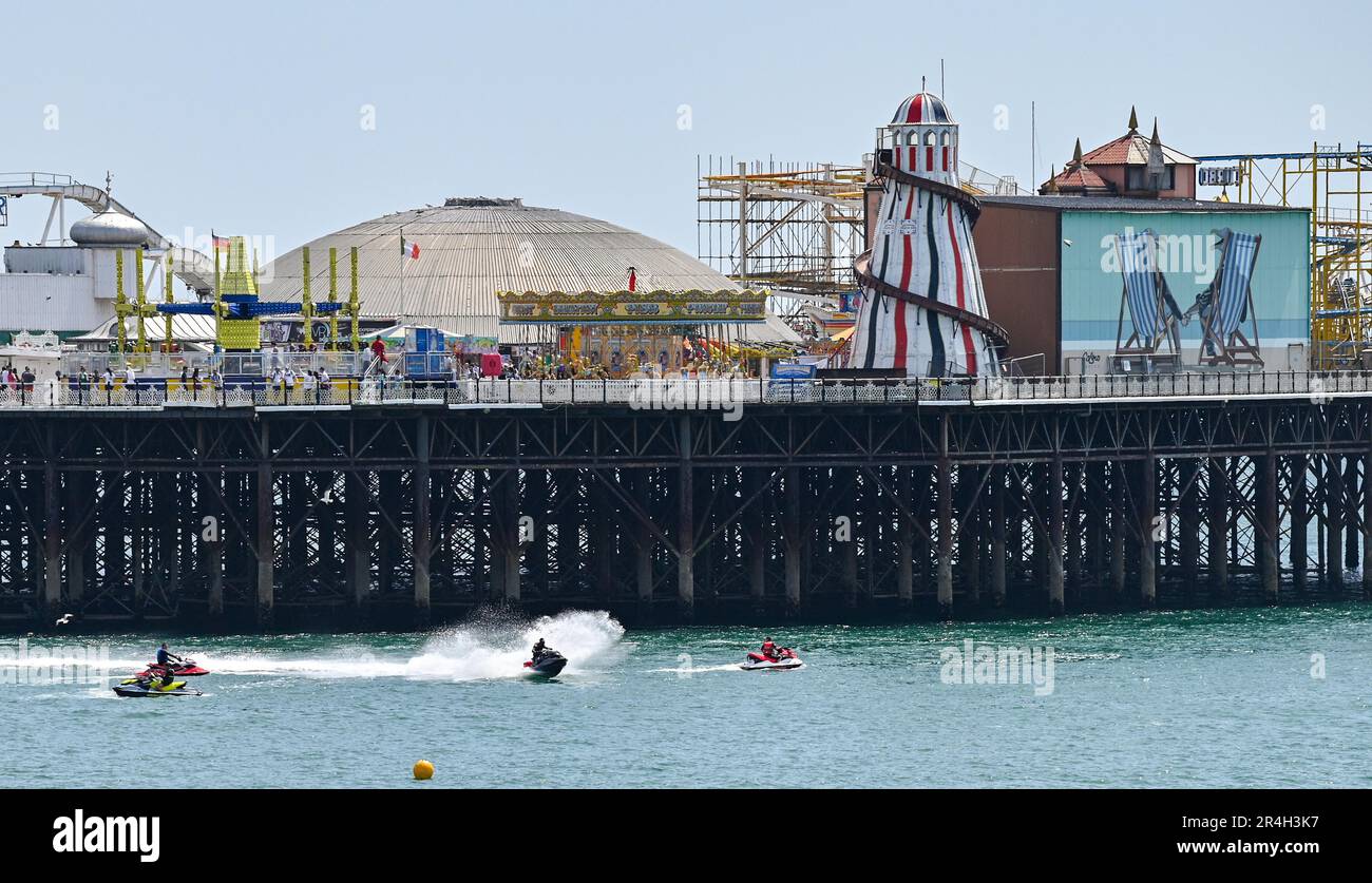 Brighton UK 28th May 2023 - Jet skiers enjoy a beautiful hot sunny day in Brighton by the pier during the bank holiday weekend with temperature reaching over 20 degrees in some parts of the UK : Credit Simon Dack / Alamy Live News Stock Photo
