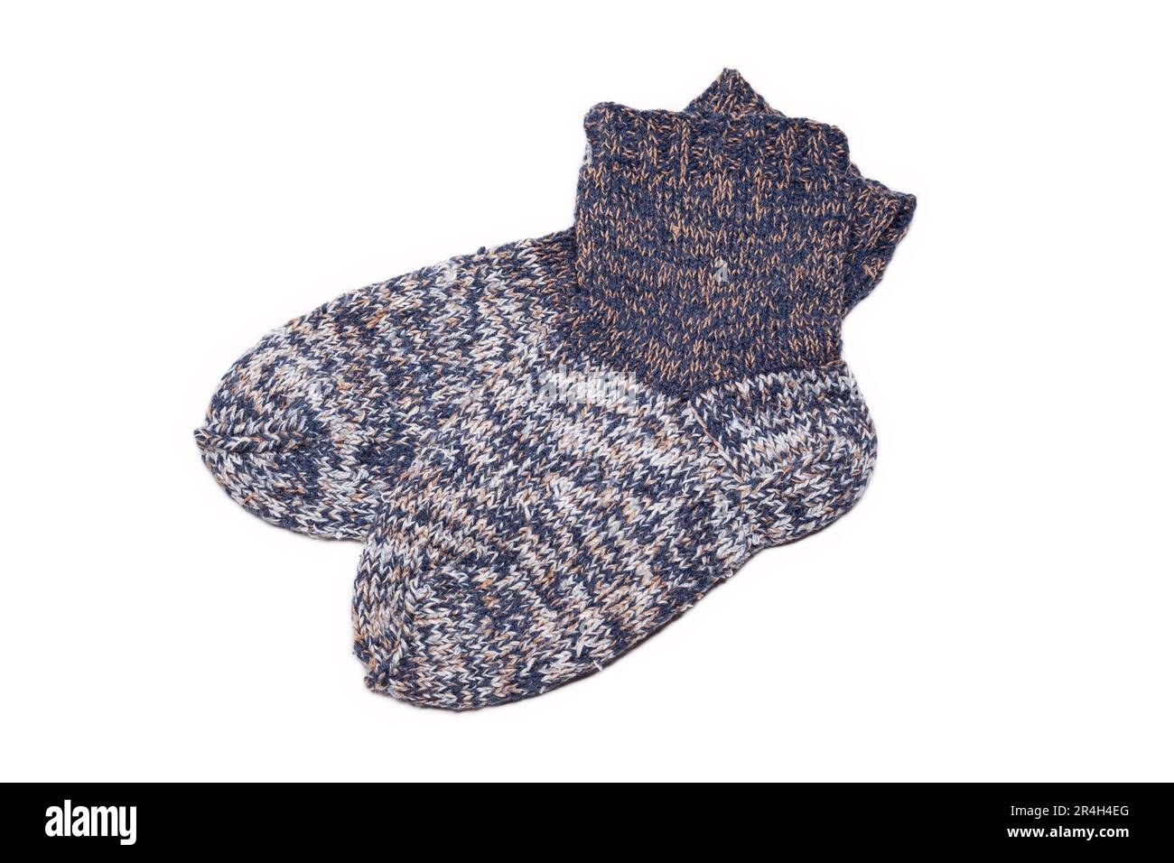 Knitted wool, handmade socks on a white background Stock Photo