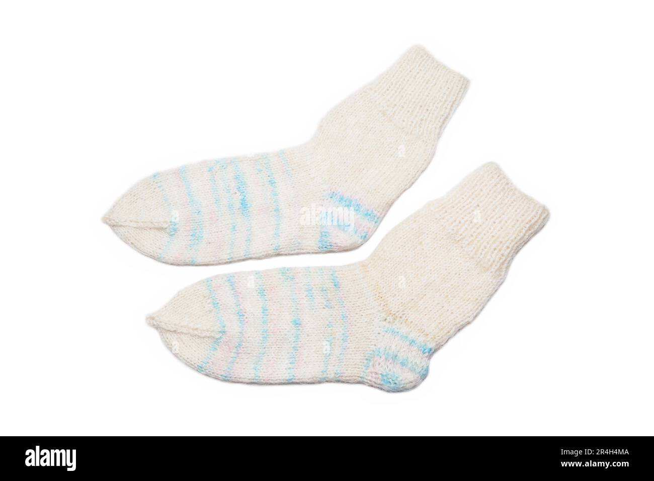 Knitted wool, handmade socks on a white background Stock Photo