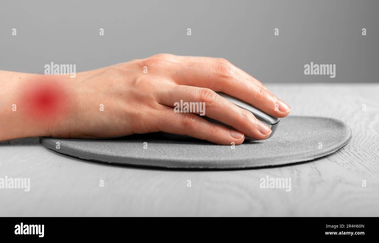 Wrist pain concept. Hand lying on computer mouse Stock Photo Alamy