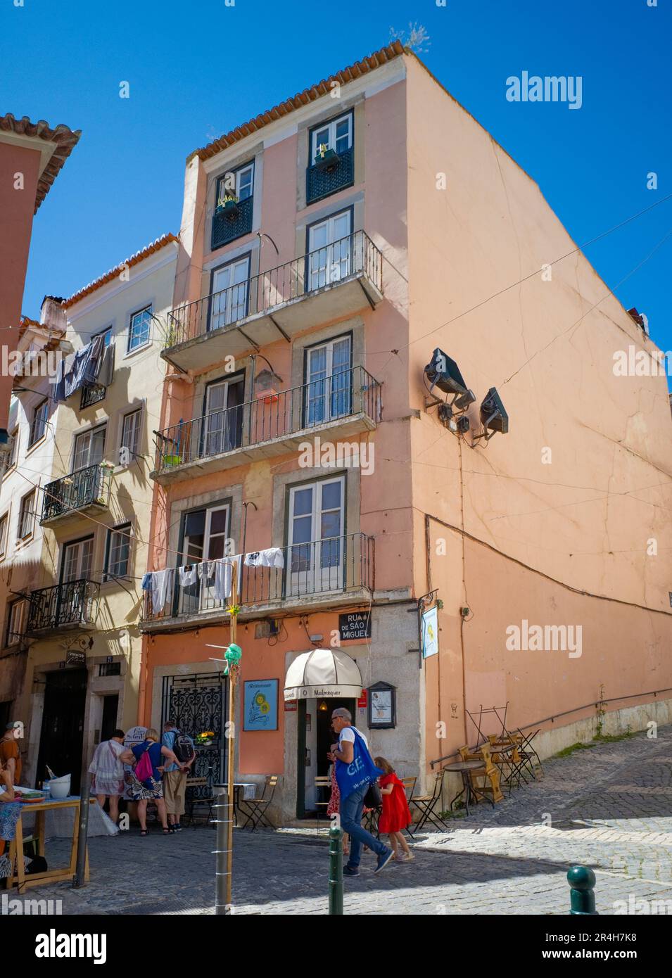 Tall buildings in the Alfama district of Lisbon where old and new meet Stock Photo