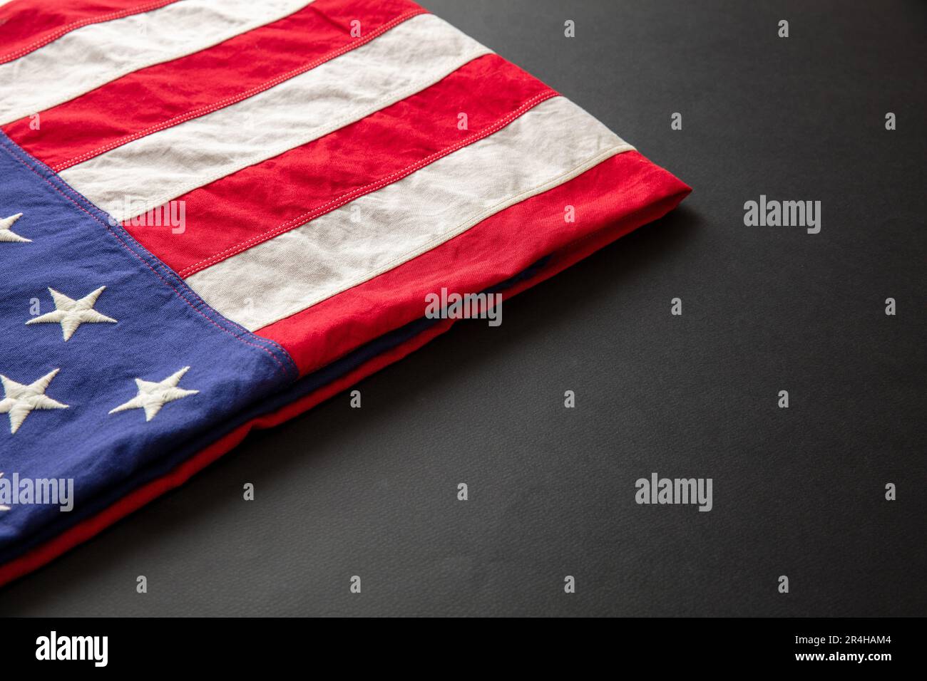 American flag folded on black background, US America National Holiday ...