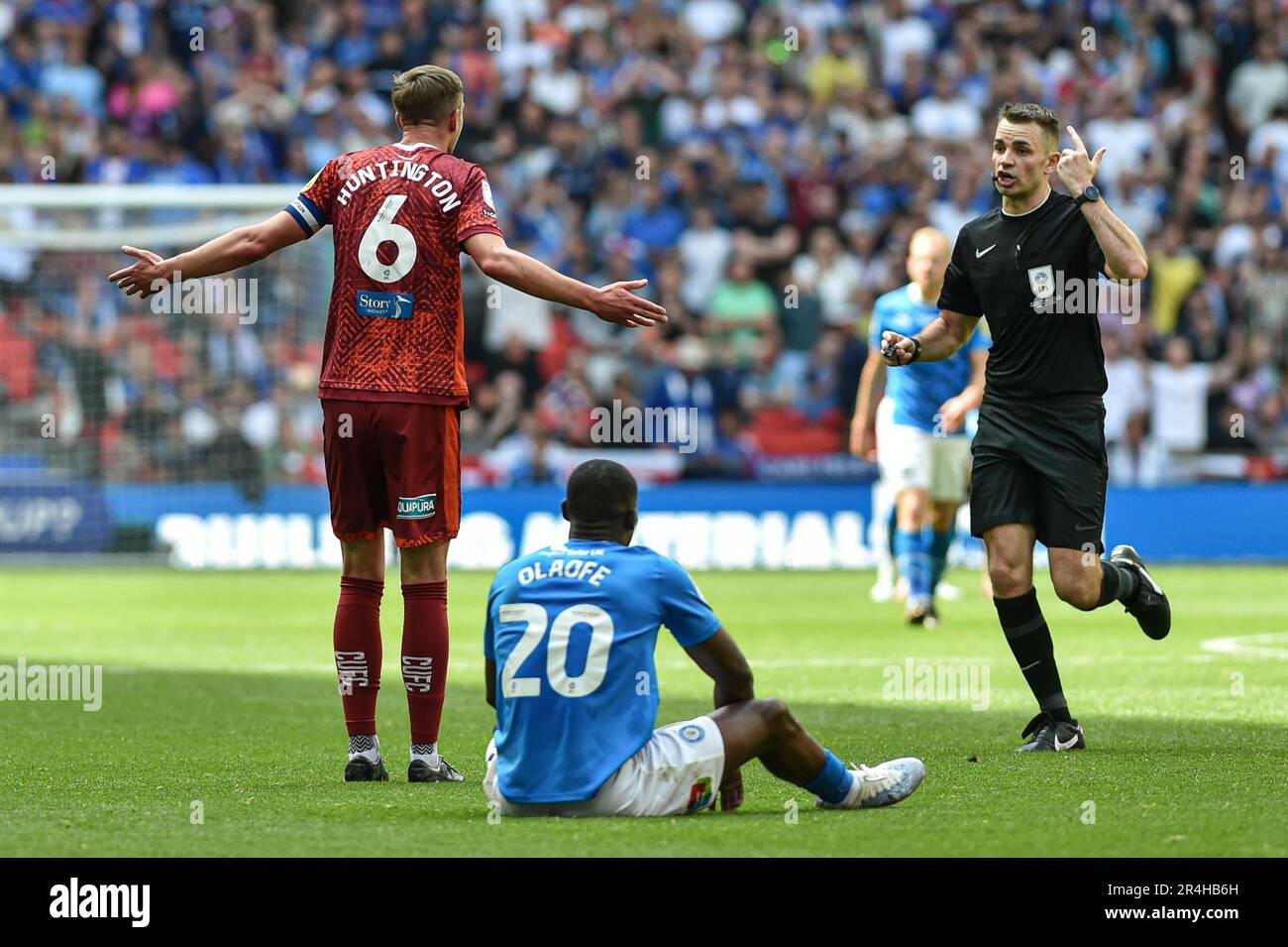 Wembley Stadium, London, UK. 28th May, 2023. EFL League Two Play Off Football Final, Carlisle United versus Stockport County; Paul Huntington of Carlisle complains to Tom Nield after conceding a foul against Isaac Olaofe of Stockport Credit: Action Plus Sports/Alamy Live News Stock Photo