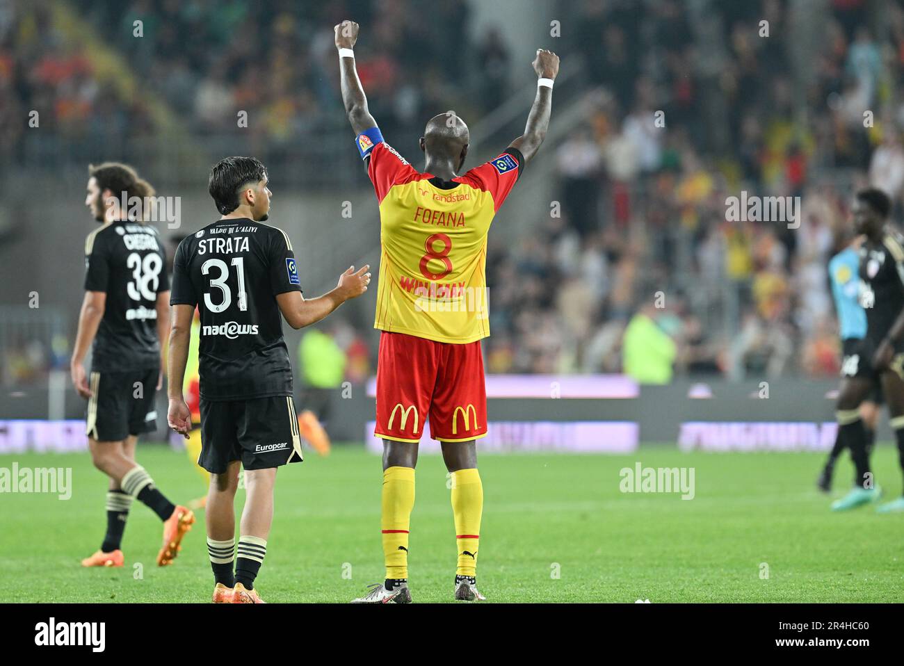 players of RC Lens and their president Joseph Oughourlian pictured  celebrating after winning and qualifying for the Champions League after a  soccer game between t Racing Club de Lens and AC Ajaccio