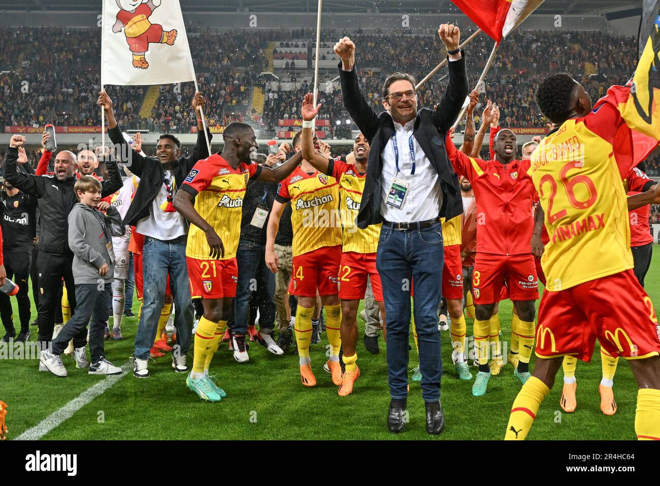 players of RC Lens and their president Joseph Oughourlian pictured  celebrating after winning and qualifying for the Champions League after a  soccer game between t Racing Club de Lens and AC Ajaccio