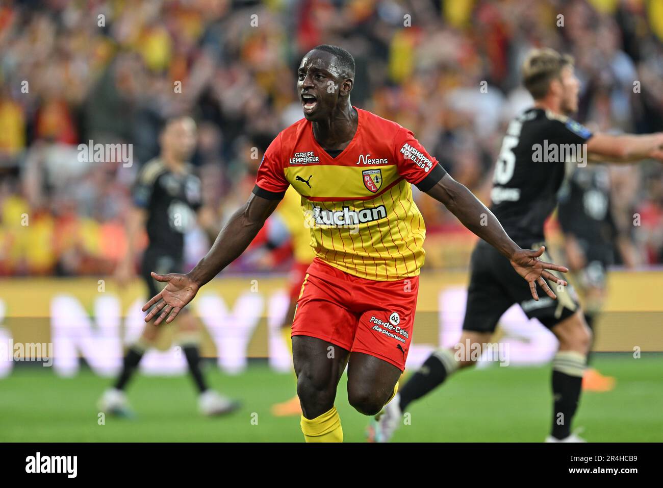 players of RC Lens and their president Joseph Oughourlian pictured  celebrating after winning and qualifying for the Champions League after a  soccer game between t Racing Club de Lens and AC Ajaccio