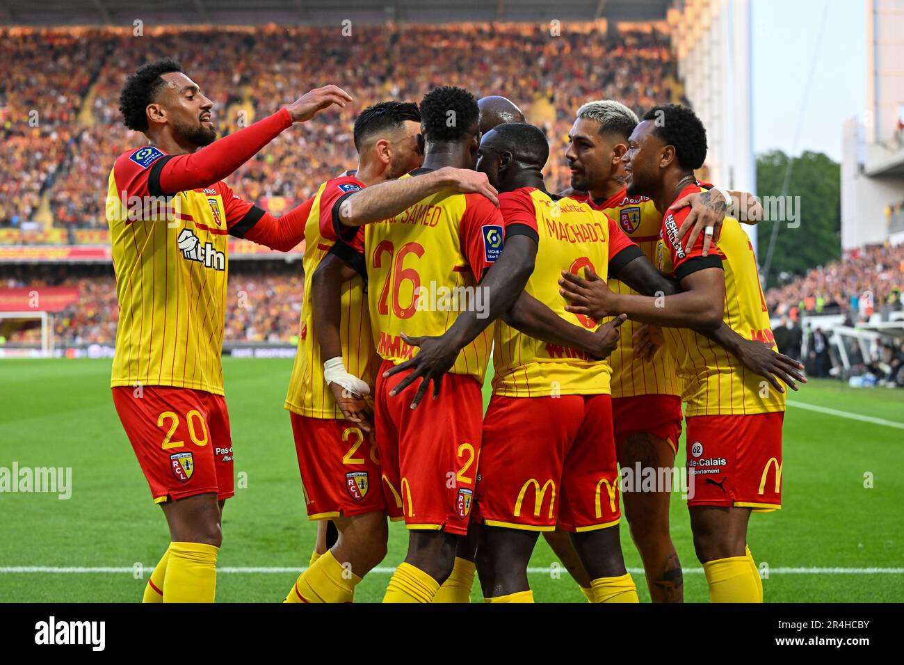 players of RC Lens and their president Joseph Oughourlian pictured  celebrating after winning and qualifying for the Champions League after a  soccer game between t Racing Club de Lens and AC Ajaccio