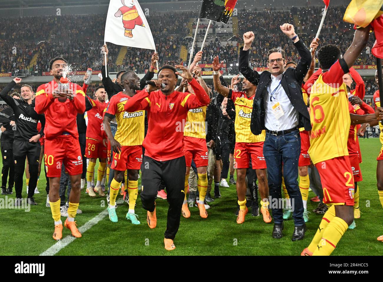 players of RC Lens and their president Joseph Oughourlian pictured  celebrating after winning and qualifying for the Champions League after a  soccer game between t Racing Club de Lens and AC Ajaccio