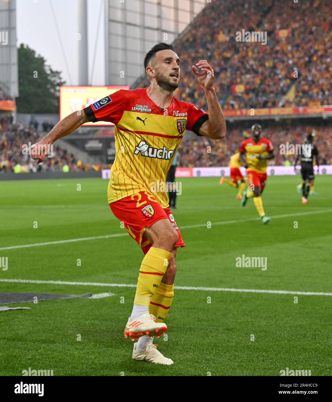 players of RC Lens and their president Joseph Oughourlian pictured  celebrating after winning and qualifying for the Champions League after a  soccer game between t Racing Club de Lens and AC Ajaccio