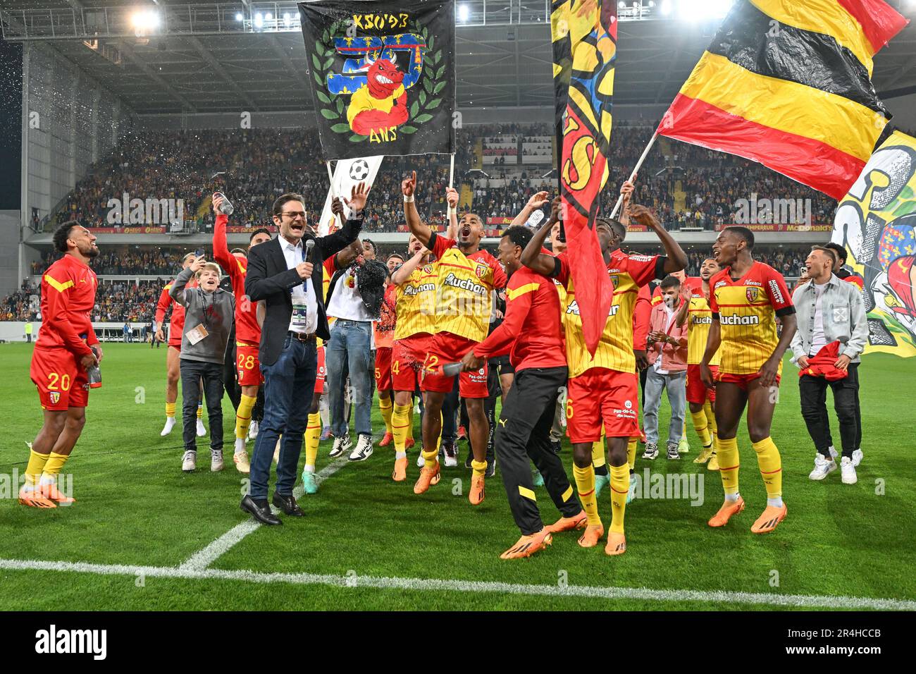 players of RC Lens and their president Joseph Oughourlian pictured  celebrating after winning and qualifying for the Champions League after a  soccer game between t Racing Club de Lens and AC Ajaccio