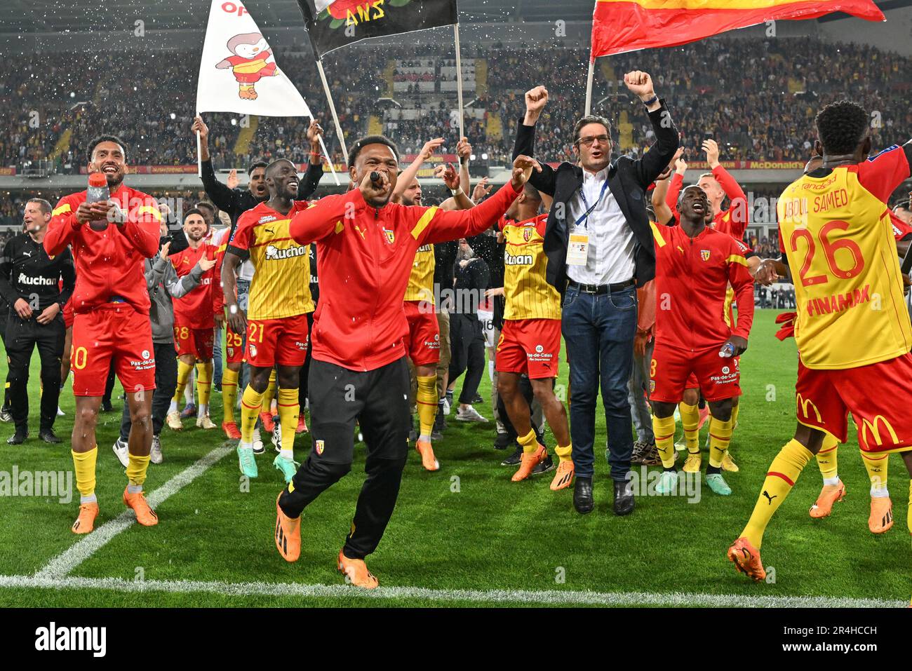 players of RC Lens and their president Joseph Oughourlian pictured  celebrating after winning and qualifying for the Champions League after a  soccer game between t Racing Club de Lens and AC Ajaccio