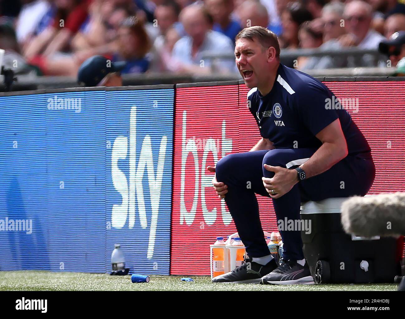Stockport County manager Dave Challinor sits on an ice bucket on the