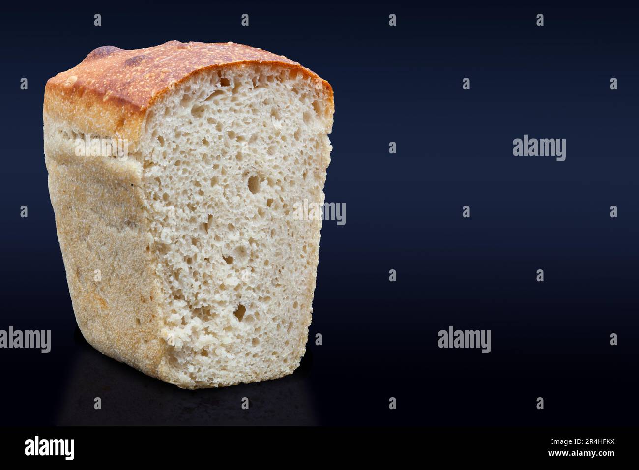 https://c8.alamy.com/comp/2R4HFKX/rye-bread-on-a-dark-background-in-the-cut-with-a-crispy-crust-and-texture-in-the-hole-fresh-home-baked-sourdough-bread-photo-in-high-quality-2R4HFKX.jpg