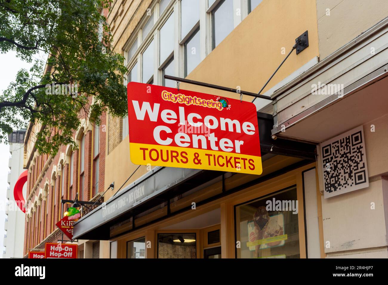 San Antonio, Texas, USA – May 9, 2023: Hanging sign for City Sightseeing Welcome Center, Tours and Tickets office located in downtown San Antonio, Tex Stock Photo