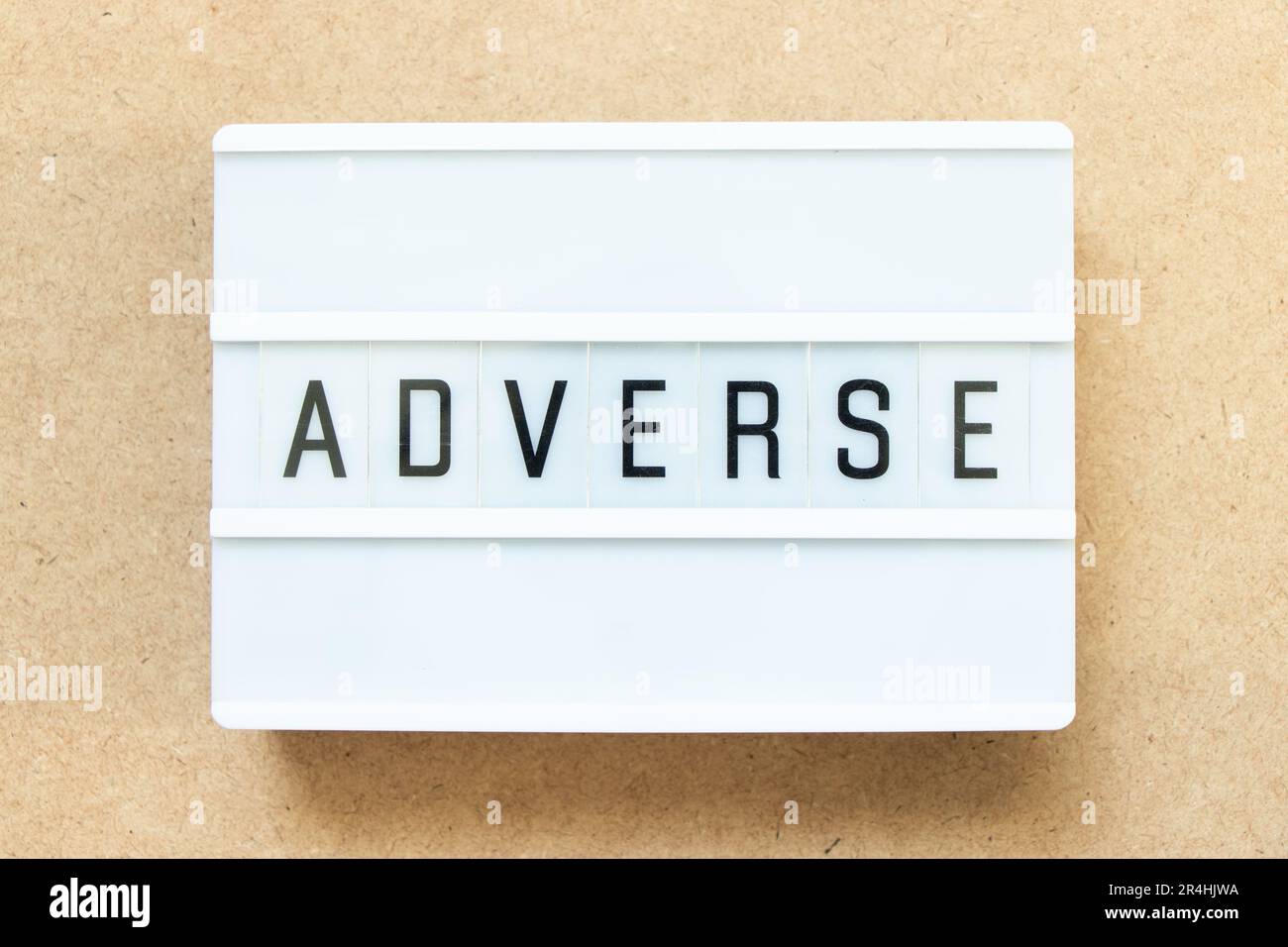 Lightbox with word adverse on wood background Stock Photo