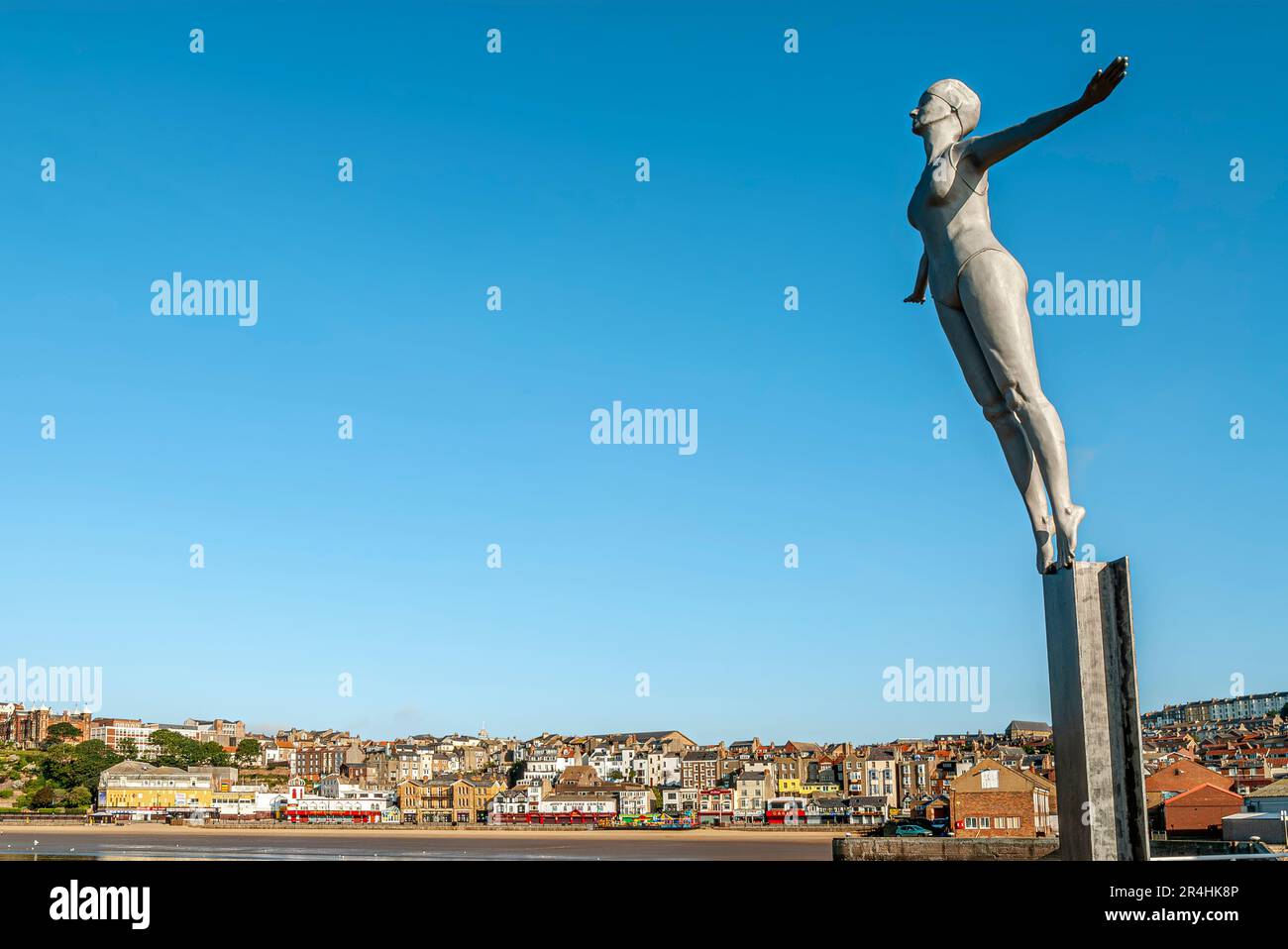 The Diving Belle Sculpture next to the Lighthouse at the harbour of Scarborough, North Yorkshire in England Stock Photo