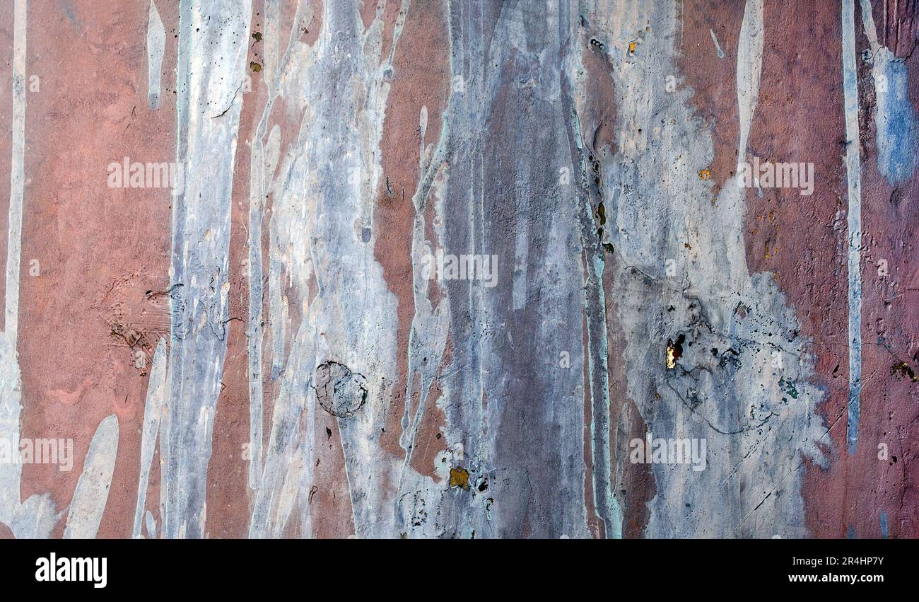 Abstract streaks of faded paint on a metal surface Stock Photo