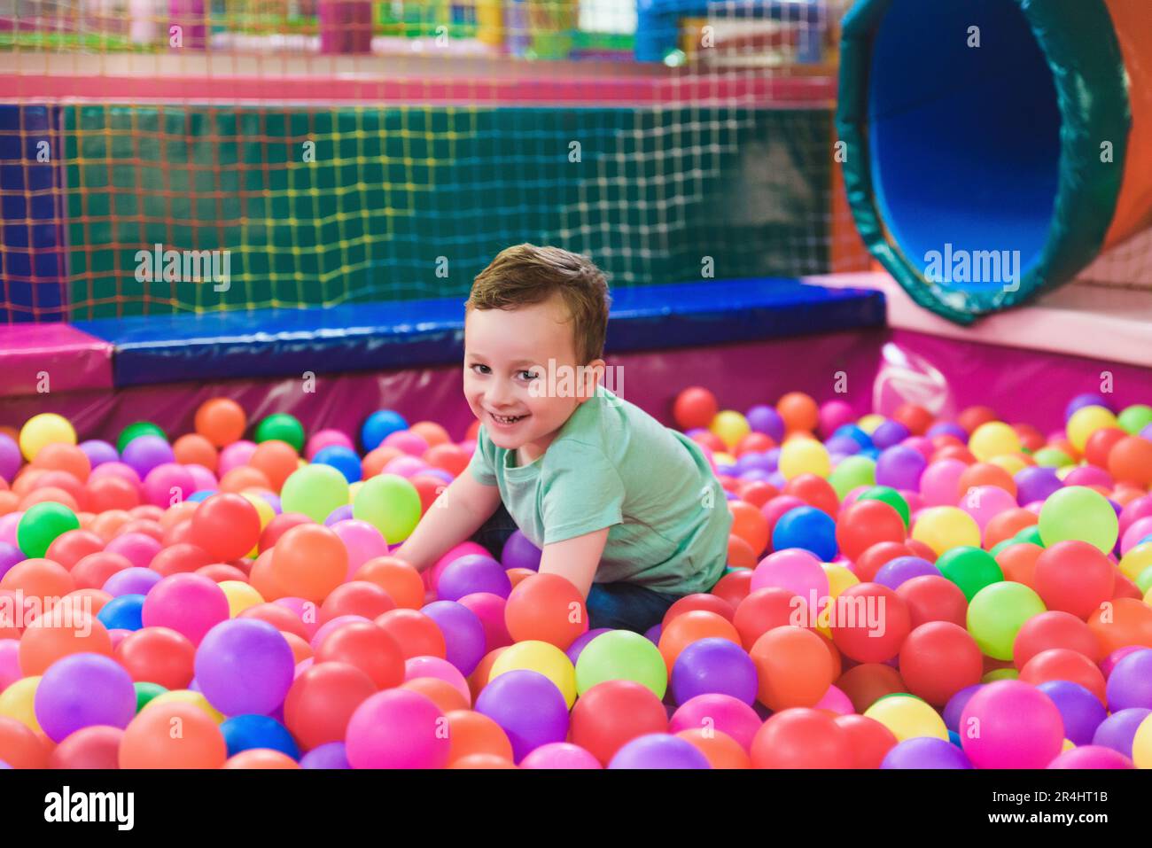 Happy laughing child laughing in an indoor play center. Children