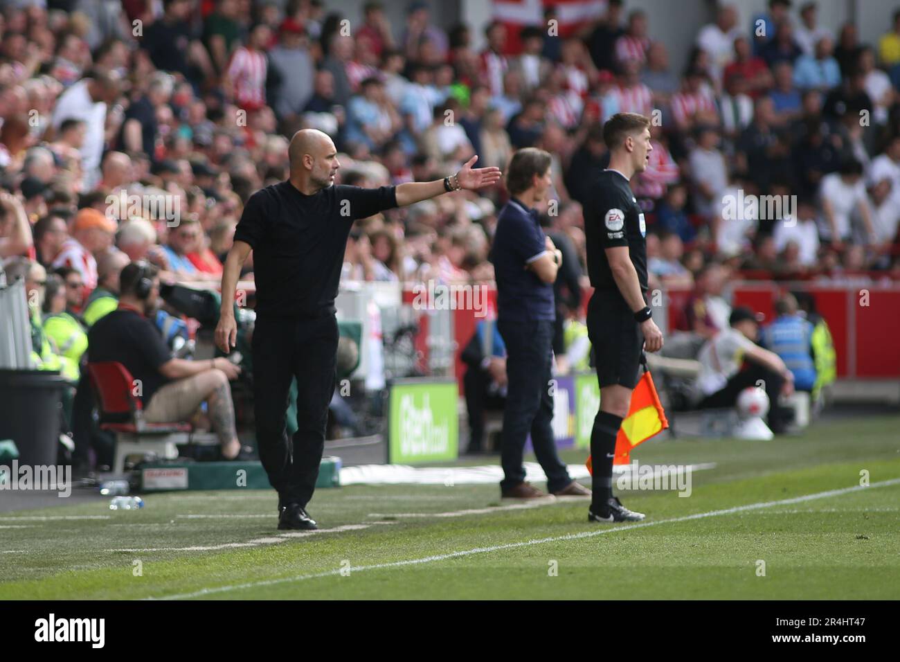 London, UK. 28th May, 2023. Manager Josep Guardiola of Manchester City sending instructions onto the pitch during the Premier League match between Brentford and Manchester City at Gtech Community Stadium, London, England on 28 May 2023. Photo by Pedro Soares. Editorial use only, license required for commercial use. No use in betting, games or a single club/league/player publications. Credit: UK Sports Pics Ltd/Alamy Live News Stock Photo