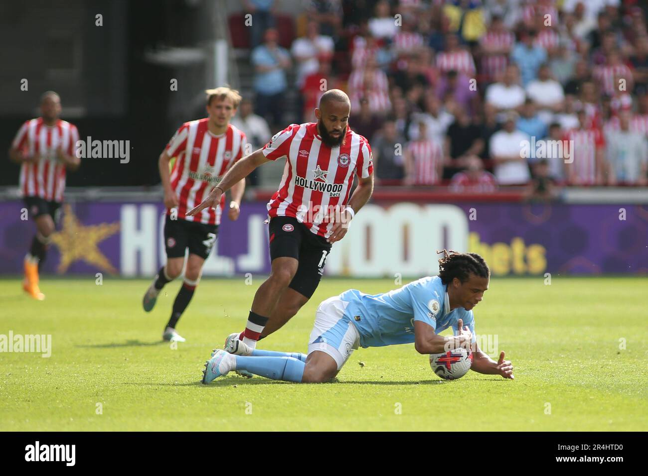 London, UK. 28th May, 2023. Nathan Ake of Manchester City fouled by Bryan Mbeumo of Brentford during the Premier League match between Brentford and Manchester City at Gtech Community Stadium, London, England on 28 May 2023. Photo by Pedro Soares. Editorial use only, license required for commercial use. No use in betting, games or a single club/league/player publications. Credit: UK Sports Pics Ltd/Alamy Live News Stock Photo