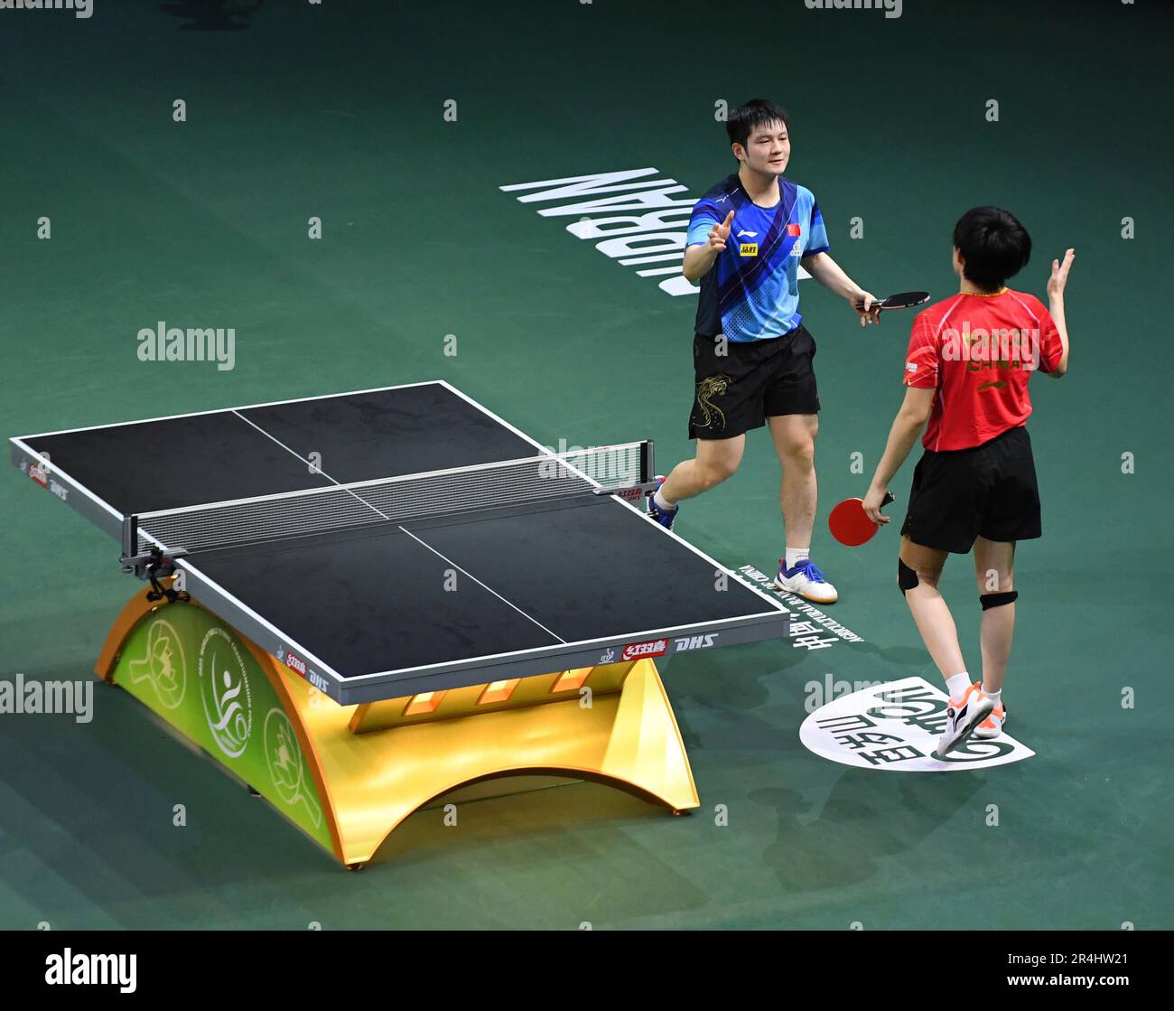 Durban, South Africa. 28th May, 2023. China's Fan Zhendong (L) greets