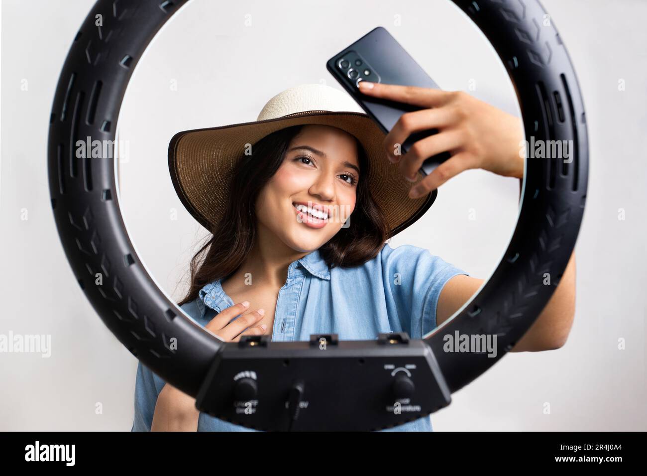 Young girl taking a selfie with a light ring Stock Photo
