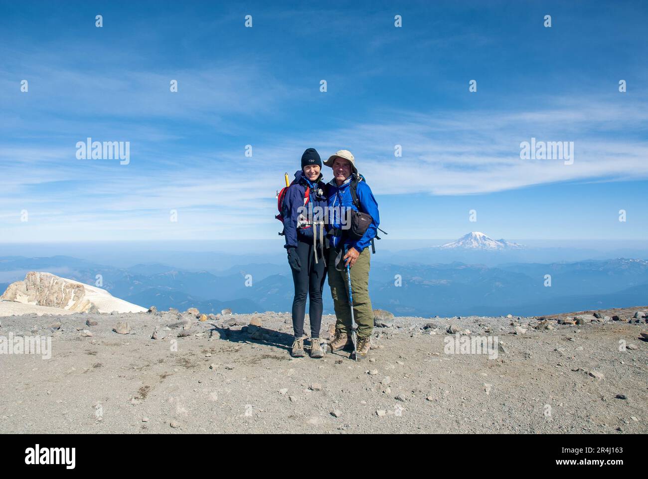 Couple on the summit of Mount Adams, Washington State. USA Stock Photo