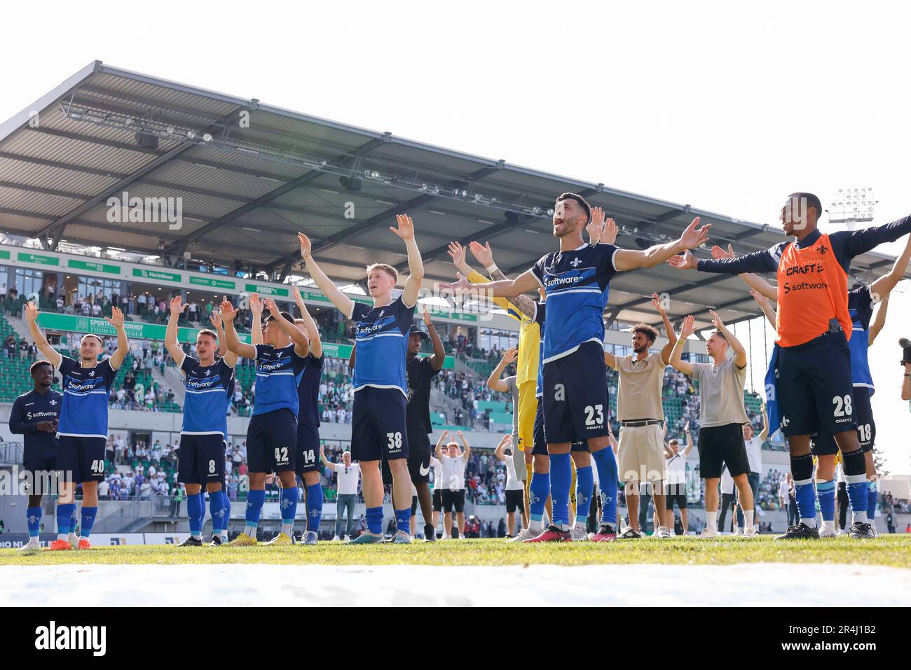28 May 2023, Bavaria, Fürth: Soccer: 2. Bundesliga, SpVgg Greuther Fürth - Darmstadt 98, Matchday 34, Sportpark Ronhof Thomas Sommer. Darmstadt's Filip Stojilkovic (l-r), Fabian Schnellhardt, Fabio Torsiello, Clemens Riedel, Klaus Gjasula and Yassin Ben Balla cheer on their fans. Photo: Daniel Löb/dpa - IMPORTANT NOTE: In accordance with the requirements of the DFL Deutsche Fußball Liga and the DFB Deutscher Fußball-Bund, it is prohibited to use or have used photographs taken in the stadium and/or of the match in the form of sequence pictures and/or video-like photo series. Stock Photo