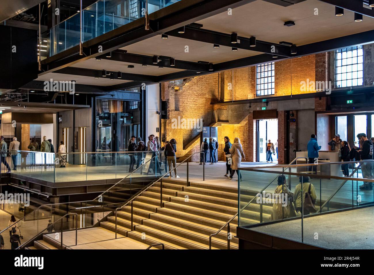 People at the South entrance atrium at the newly refurbished  Battersea Power Station now a major shopping and leisure destination , London SW11 Stock Photo