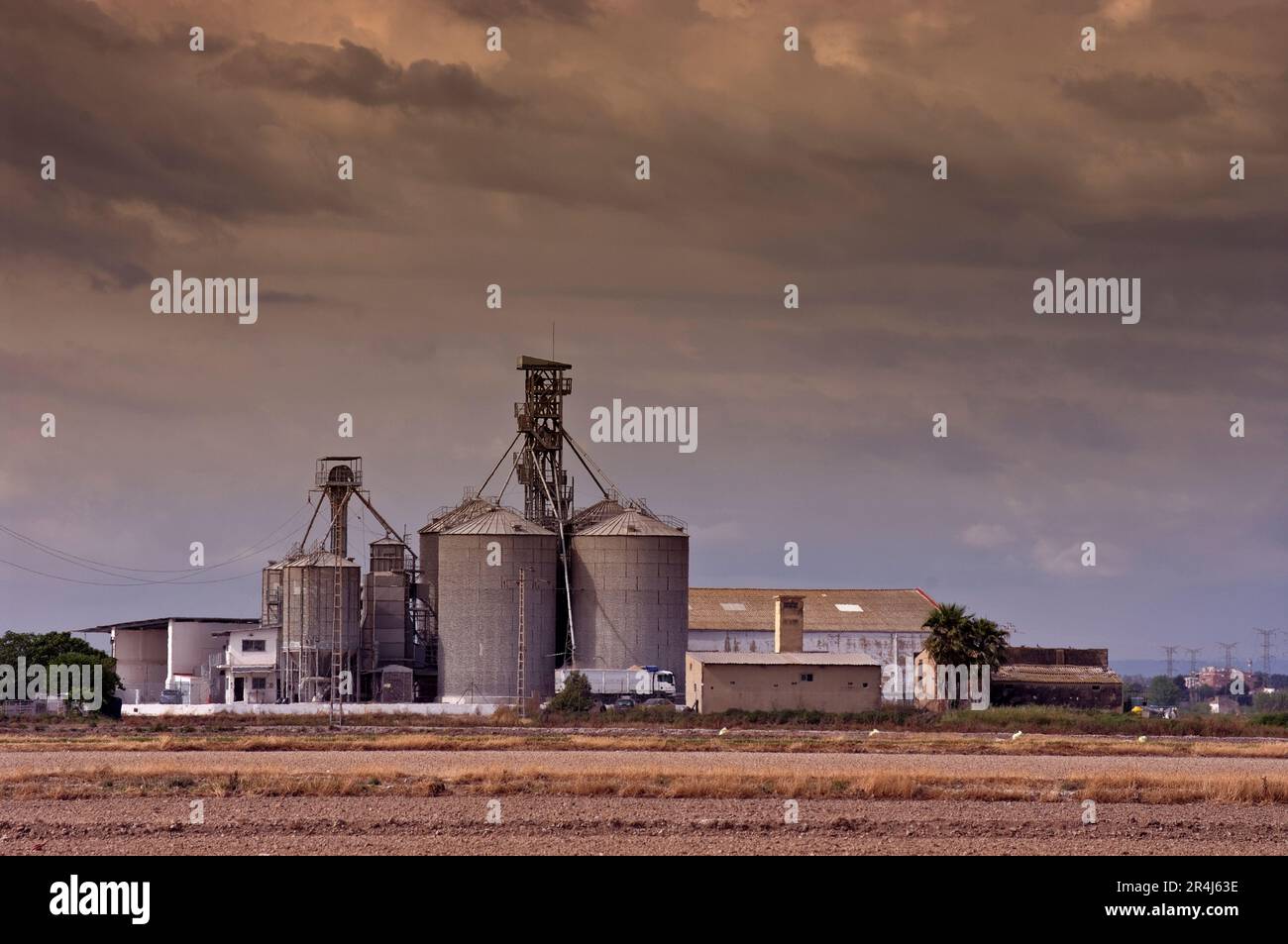 Silos with sunset clouds to store rice from the Albufera of Valencia Spain. Stock Photo